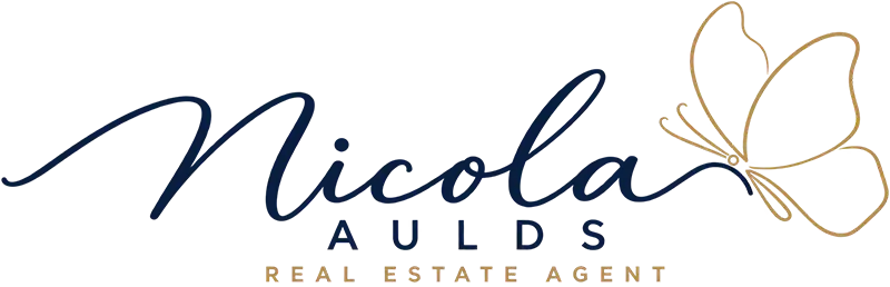 Nicola Aulds Realty custom logo featuring elegant navy blue lettering and a gold butterfly, created by Envisager Studio for a real estate WordPress website design project.
